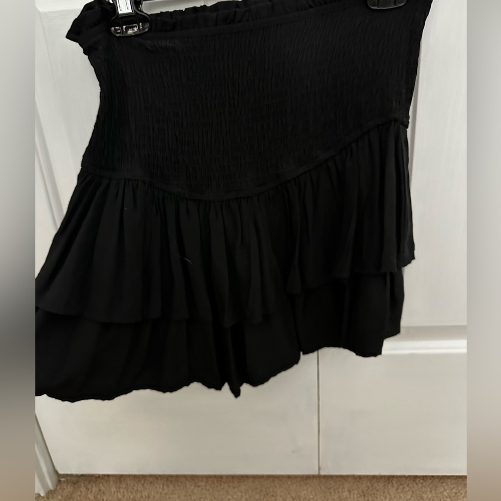 a black skirt ruffled at the bottom in very good condition.